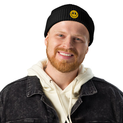 Man wearing Black Beanie Hat Smiley Face Embroidered Arczeal designs 